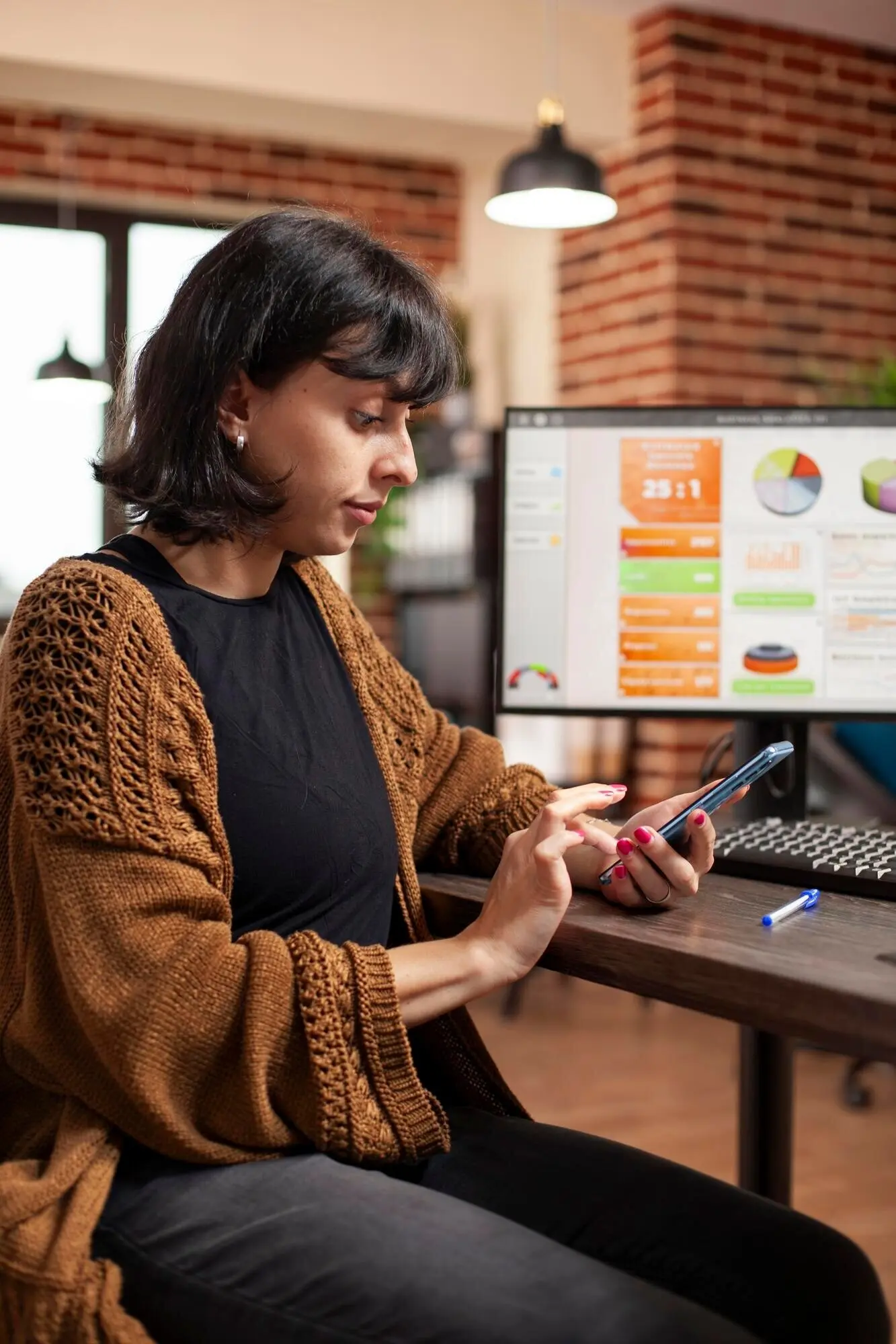 Employee reviewing emails on a mobile phone